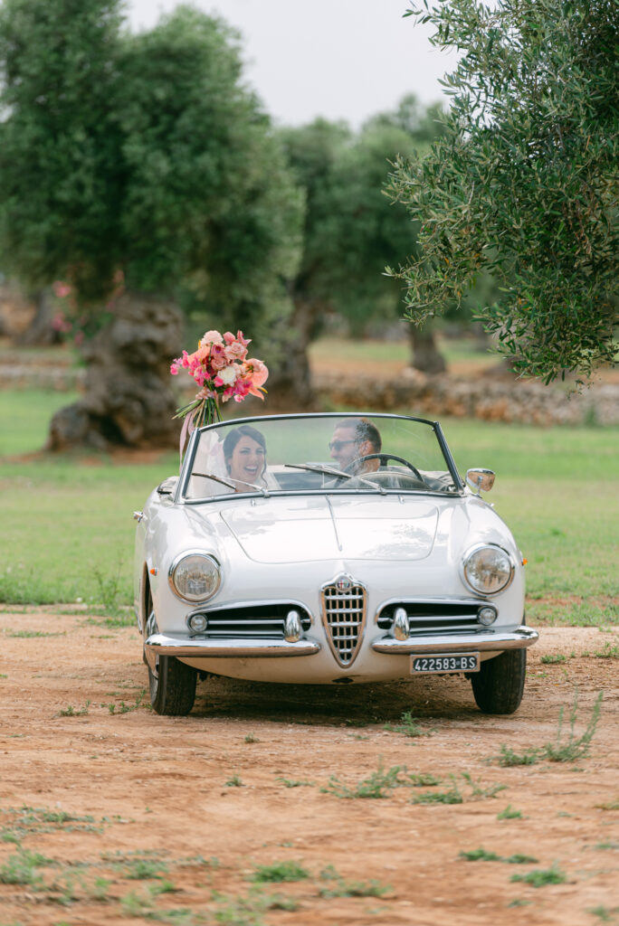 bride arrive in vintage car